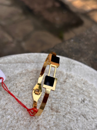 Gold Bracelets with Black Square Accents